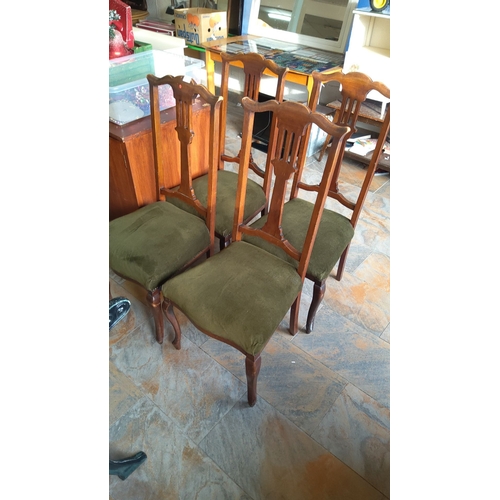 315 - Set of four antique mahogany 
dining chairs with green upholstered seats, featuring elegant curved b... 