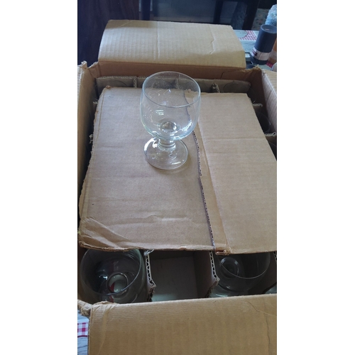 358 - Box of 40 clear glass goblets in original packaging, featuring a classic rounded bowl with sturdy st... 