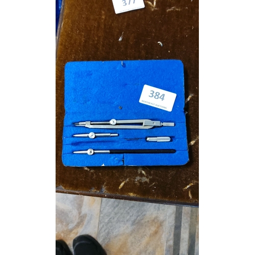 384 - Vintage drafting tool set includes four metal instruments in a blue felt case, from the mid-century.