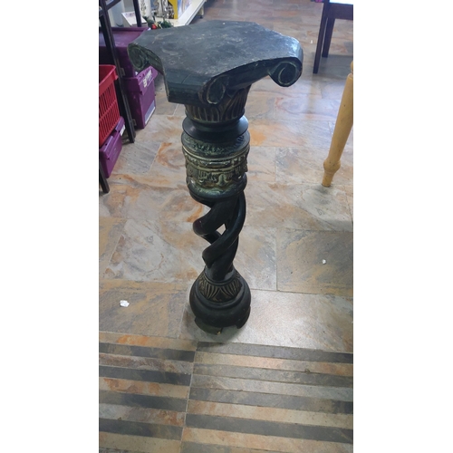 39 - Antique spiral column pedestal with Ionic capital, crafted in dark wood and adorned with intricate c... 