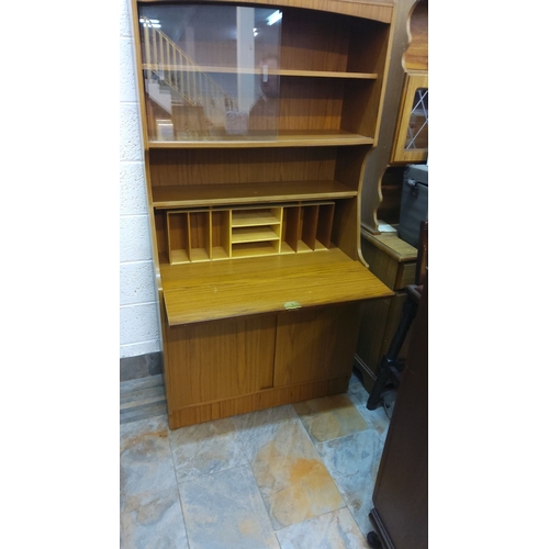 449 - Mid-Century oak writing bureau with shelving and compartments.