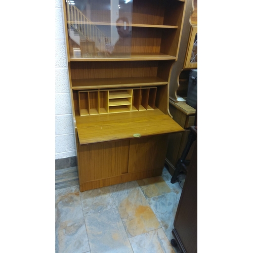 449 - Mid-Century oak writing bureau with shelving and compartments.