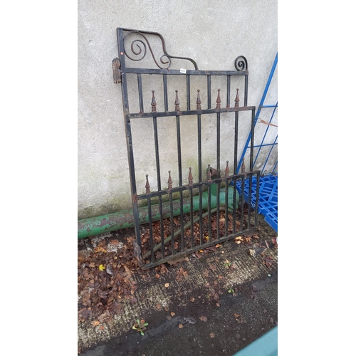 459 - Wrought iron gate featuring decorative scrollwork and finial accents, from the Victorian period.