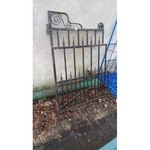 459 - Wrought iron gate featuring decorative scrollwork and finial accents, from the Victorian period.