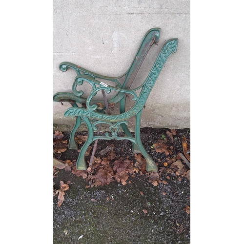 471 - Pair of vintage green cast iron bench ends with ornate scrollwork design.