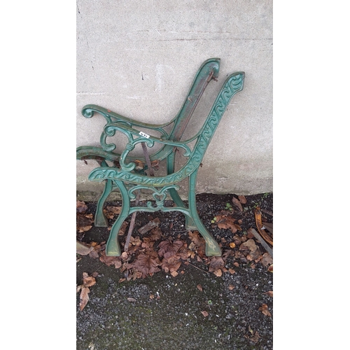 471 - Pair of vintage green cast iron bench ends with ornate scrollwork design.