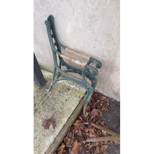 472 - Cast iron bench ends feature a classic scroll design.