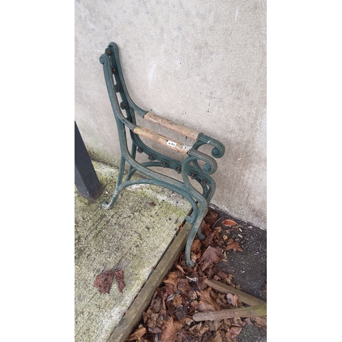 472 - Cast iron bench ends feature a classic scroll design.