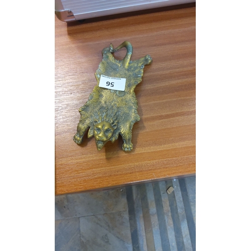 56 - Brass lion door knocker, depicting a lion with detailed mane and subtle patina, in classic Victorian... 