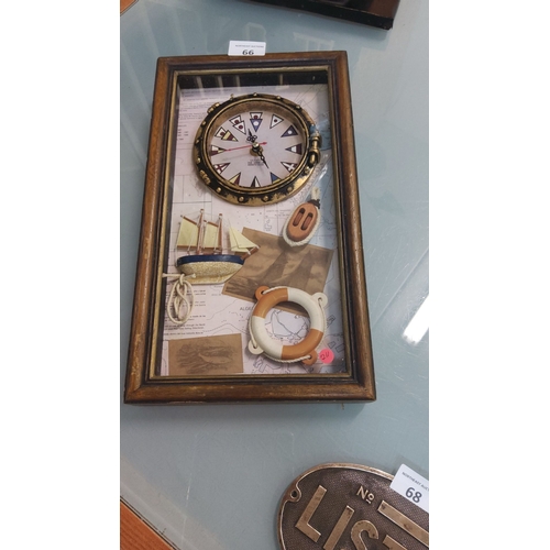 66 - Wall clock with maritime motifs, featuring a ship, life preserver, and wooden frame. Quartz movement... 