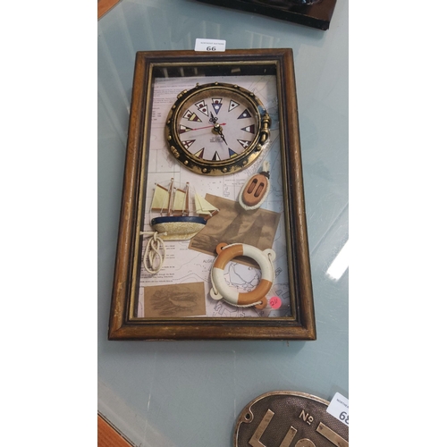 66 - Wall clock with maritime motifs, featuring a ship, life preserver, and wooden frame. Quartz movement... 