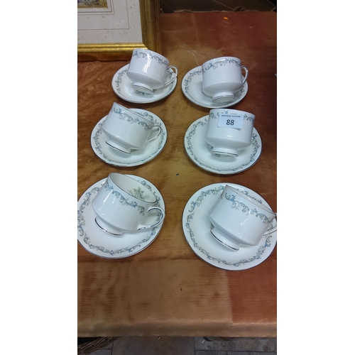 88 - Set of six Paragon fine china teacups and saucers with elegant floral scroll pattern in blue and sil... 