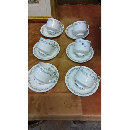 88 - Set of six Paragon fine china teacups and saucers with elegant floral scroll pattern in blue and sil... 