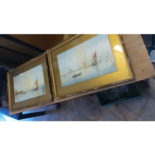 326 - Pair of framed prints depicting nautical scenes. Gold frames with matted borders accentuate vibrant ... 