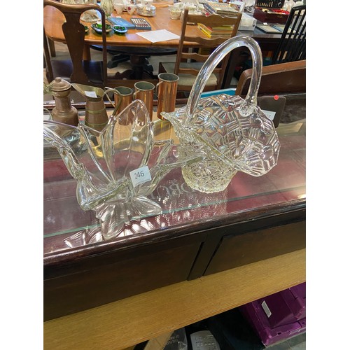 246 - Set of two decorative glass bowls, featuring a leaf-shaped and a patterned design. Clear glass const... 