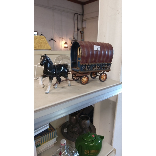 1 - Vintage ceramic horse-drawn gypsy caravan model, featuring intricate painted details and rustic char... 