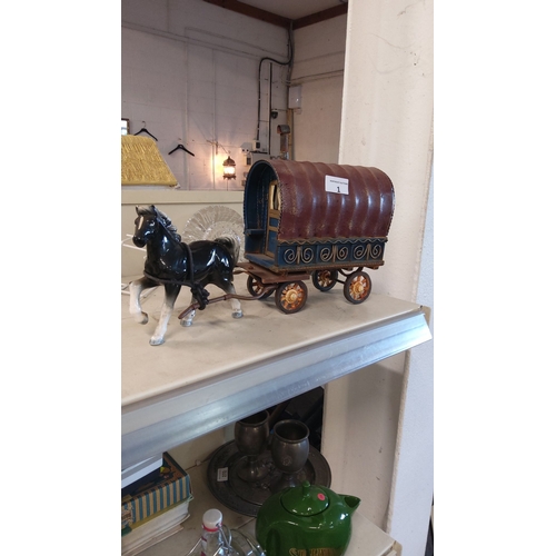 1 - Vintage ceramic horse-drawn gypsy caravan model, featuring intricate painted details and rustic char... 