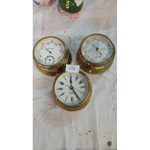 174 - Brass nautical instrument set includes a barometer, hygrometer, and clock. It features a classic des... 