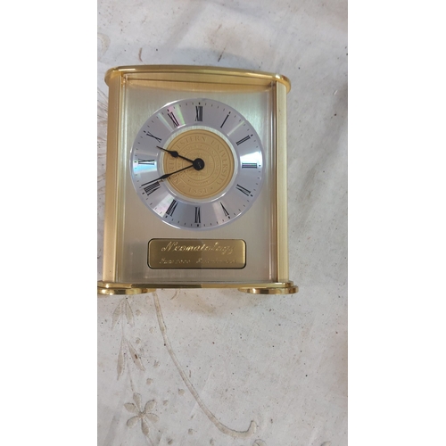 175 - Brass mantel clock features Northwestern University insignia, Roman numerals, and a brushed metal fi... 