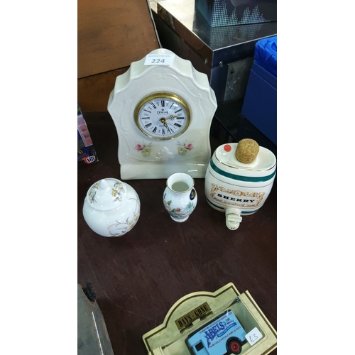 224 - A mixed lot includes a Donegal clock, floral porcelain vase, lidded jar, and Sherry decanter.