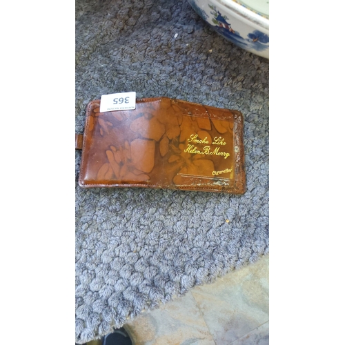 365 - Vintage leather cigarette case with embossed inscription, featuring a snap closure and marbled brown... 