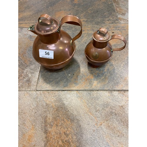 56 - 2 vintage  copper kettles with hinged lid and curved spout,from the early 20th century.