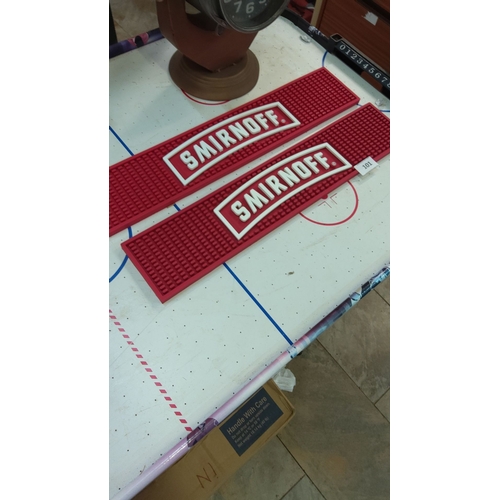 101 - Pair of Smirnoff branded red rubber bar mats, featuring bold white logo.