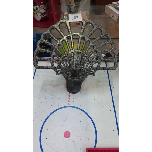 103 - Cast iron book/menu stand with a peacock tail design, featuring a textured, speckled finish.