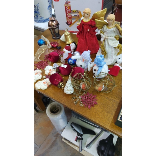 107 - Collection of assorted Christmas decorations, including two angel figurines, plush snowmen, Santa or... 