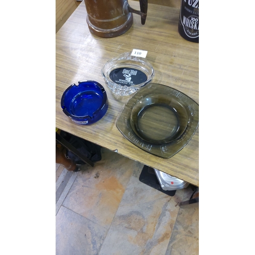 110 - Set of three glass ashtrays: vibrant blue Bavaria, clear Innsbruck Tirol, and dark-tinted Roundhouse... 