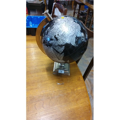 31 - Contemporary black and silver globe with metal base, featuring detailed map and modern design.