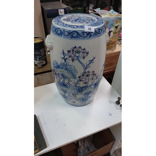 38 - Chinese porcelain garden stool, hand-painted floral and cloud motifs, featuring blue and white glaze... 