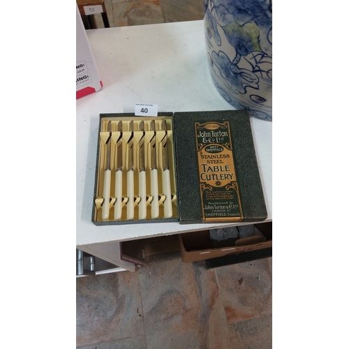 40 - Set of six vintage John Turton & Co Ltd stainless steel table knives with cream handles. Includes or... 