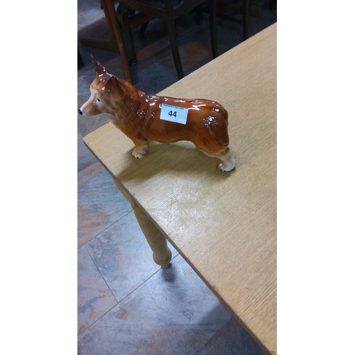 44 - Ceramic figurine of a Corgi dog, glazed finish. Marked 