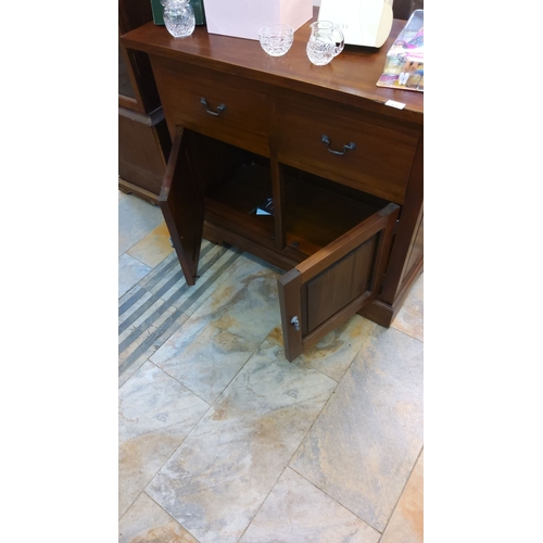 67 - Mahogany side cabinet with upper drawers and lower doors. Classic handles enhance its traditional de... 