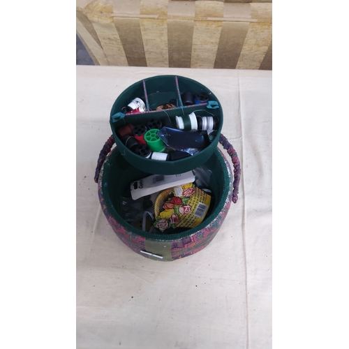 7 - Fabric-covered sewing basket with handle, featuring a colorful geometric pattern. Interior includes ... 