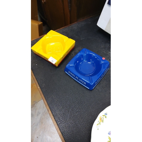 71 - Set of two vintage ceramic ashtrays, featuring vibrant 