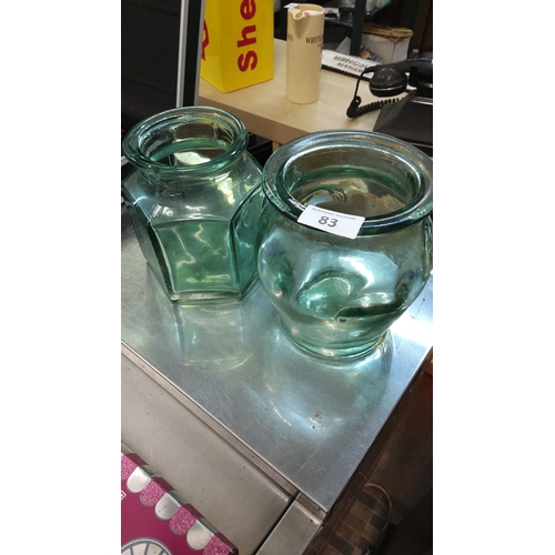 83 - Pair of vintage green glass jars with wide openings.