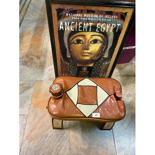 42 - Embellished brown leather footstool features Egyptian-inspired motifs and intricate geometric patter... 