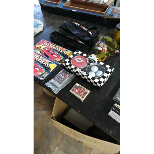 164 - The NASCAR memorabilia lot includes Jeff Gordon tins, Dale Earnhardt Jr. golf set, collectible caps,... 