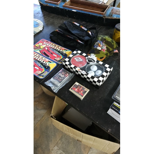 164 - The NASCAR memorabilia lot includes Jeff Gordon tins, Dale Earnhardt Jr. golf set, collectible caps,... 