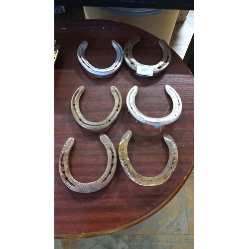 167 - Set of six vintage iron horseshoes, showcasing charming patina and rustic appeal.