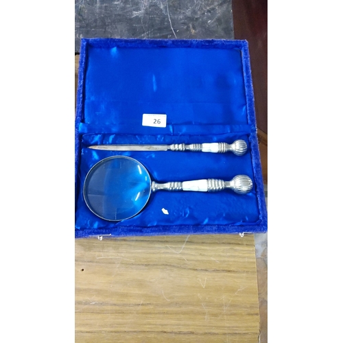 26 - Mother-of-pearl handled magnifying glass and letter opener set, in blue velvet-lined case.