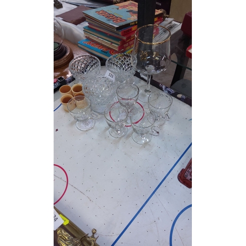 123 - Crystal and glassware collection features etched goblets and vintage cut-glass bowls; accompanied by... 