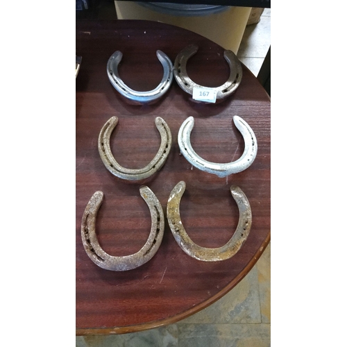 167 - Set of six vintage iron horseshoes, showcasing charming patina and rustic appeal.