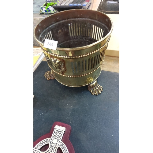 244 - Victorian brass planter with ram's head motifs and claw feet.