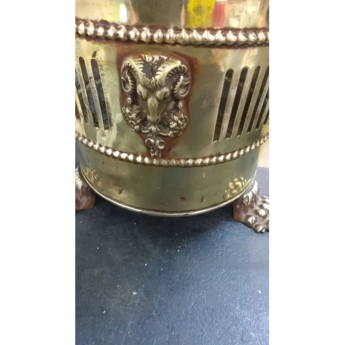 244 - Victorian brass planter with ram's head motifs and claw feet.