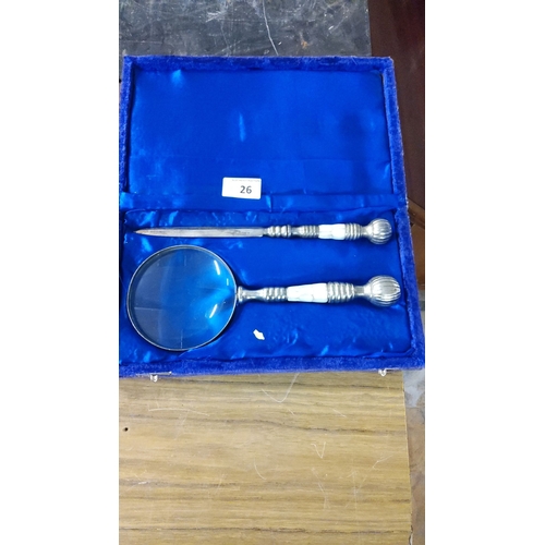 26 - Mother-of-pearl handled magnifying glass and letter opener set, in blue velvet-lined case.