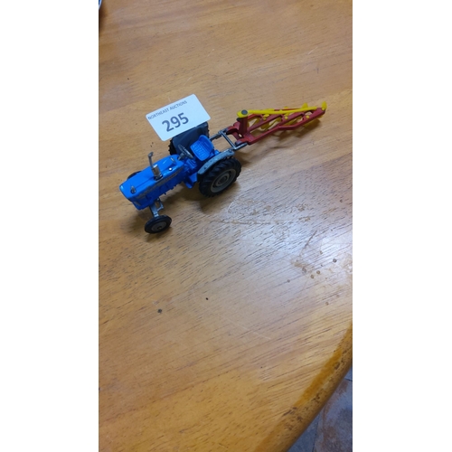 295 - Vintage die-cast model tractor with plough attachment. Excellent condition, vibrant colors.