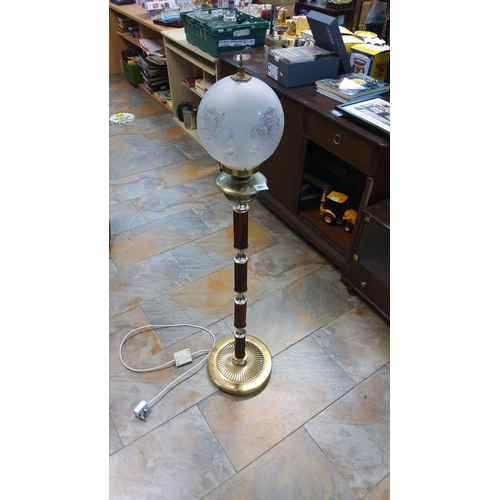 309 - Vintage floor lamp with frosted glass globe, brass accents, and elegant detailing.(4ft)